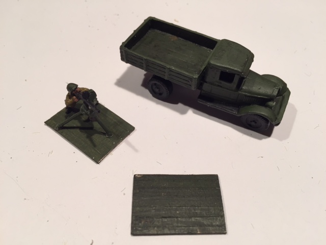 Paint and wash the truck bed before glueing down the miniatures